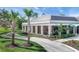 Community center with outdoor seating and landscaping at 11204 Mcdermott Ct # 11204, Englewood, FL 34223