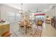 Elegant dining room with adjacent living space at 11204 Mcdermott Ct # 11204, Englewood, FL 34223