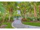 Dog park with paved path and tropical landscaping at 11204 Mcdermott Ct # 11204, Englewood, FL 34223