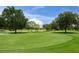 Expansive green golf course with lush landscaping at 11204 Mcdermott Ct # 11204, Englewood, FL 34223