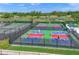 Aerial view of multiple pickleball courts in use at 11204 Mcdermott Ct # 11204, Englewood, FL 34223