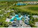 Aerial view of resort-style pool and surrounding amenities at 11204 Mcdermott Ct # 11204, Englewood, FL 34223