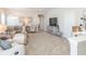 Spacious bonus room featuring a comfortable seating area and a large TV at 11571 Gleaming Ter, Venice, FL 34293