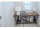 A charming console table displays Gathering photos and decorative items at 11571 Gleaming Ter, Venice, FL 34293