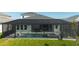 Screened-in pool and spa with spacious patio and seating area at 11571 Gleaming Ter, Venice, FL 34293