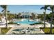 Stunning pool area with adjacent clubhouse and fire pit at 11571 Gleaming Ter, Venice, FL 34293