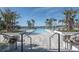 Relaxing resort-style pool with lounge chairs and lush landscaping at 11571 Gleaming Ter, Venice, FL 34293