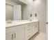 Bright bathroom with dual sinks and a spacious mirror above the vanity at 11842 Sistine Ln, Venice, FL 34293