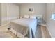 Comfortable bedroom featuring a cozy bed, carpet and a closet with sliding doors at 11842 Sistine Ln, Venice, FL 34293
