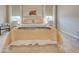 Bright bedroom featuring neutral colors, two windows, carpet flooring, and a comfortable queen-sized bed at 11842 Sistine Ln, Venice, FL 34293