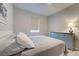 Comfortable bedroom with neutral tones, soft carpet, a ceiling fan, and a peaceful ambiance at 11842 Sistine Ln, Venice, FL 34293
