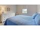 This comfortable bedroom has a window with roll-down shades, and a spacious dresser at 11842 Sistine Ln, Venice, FL 34293