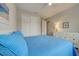 Bright bedroom with a closet with sliding doors and a spacious dresser at 11842 Sistine Ln, Venice, FL 34293