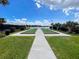 Bocce ball court surrounded by lush landscaping offers a serene outdoor recreation space at 11842 Sistine Ln, Venice, FL 34293