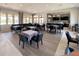 Community clubhouse offering a perfect space for events with tables, chairs, and a bar area at 11842 Sistine Ln, Venice, FL 34293