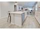 Spacious kitchen island with seating, stainless steel dishwasher, and open floorplan at 11842 Sistine Ln, Venice, FL 34293