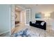 Living room with a comfortable seating area, stylish decor, and doorway view of the entryway at 11842 Sistine Ln, Venice, FL 34293