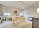 Serene main bedroom with tray ceiling, soft lighting, and plush carpeting at 11842 Sistine Ln, Venice, FL 34293