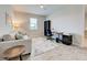 This office space has a desk, office chair, couch, and a patterned rug on wood-look tile flooring at 11842 Sistine Ln, Venice, FL 34293