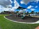 Community playground featuring slides and covered play area, perfect for outdoor fun at 11842 Sistine Ln, Venice, FL 34293