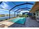 Beautiful screened-in pool with a tranquil water view, perfect for relaxing at 11842 Sistine Ln, Venice, FL 34293