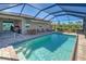 Beautiful screened-in pool and patio area, perfect for relaxing and entertaining at 11842 Sistine Ln, Venice, FL 34293