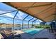 Relaxing screened pool offers a shaded seating area, and a great view of the scenic waterway at 11842 Sistine Ln, Venice, FL 34293