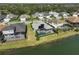 Aerial view of a luxury home community with a lake at 12353 Auburndale Ct, Venice, FL 34293