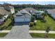 Luxury home with a three-car garage and landscaped yard at 12353 Auburndale Ct, Venice, FL 34293