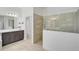 Bathroom with walk-in shower and modern vanity at 12353 Auburndale Ct, Venice, FL 34293