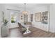 Bright dining room with built-in storage and hardwood floors at 12353 Auburndale Ct, Venice, FL 34293