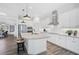 Modern kitchen with white cabinets, granite countertops and stainless steel appliances at 12353 Auburndale Ct, Venice, FL 34293