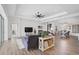 Open concept living space with hardwood floors and shiplap feature wall at 12353 Auburndale Ct, Venice, FL 34293