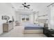 Main bedroom with a ceiling fan and large windows at 12353 Auburndale Ct, Venice, FL 34293