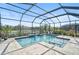 Luxury pool and spa with screened enclosure and lake view at 12353 Auburndale Ct, Venice, FL 34293