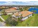 Aerial view of a house on a lakefront property at 13334 Pacchio St, Venice, FL 34293