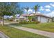 Single-Gathering home with tile roof, landscaping, and two-car garage at 13334 Pacchio St, Venice, FL 34293