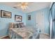 Comfortable bedroom with light blue walls and a queen-sized bed at 13492 Dibella Ave, Port Charlotte, FL 33981