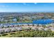 Aerial view of a large waterfront community with many houses at 13542 Abercrombie Dr, Englewood, FL 34223