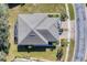 Aerial view of single-Gathering home with gray roof and landscaped yard at 13542 Abercrombie Dr, Englewood, FL 34223