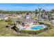 Community pool and clubhouse aerial view at 13542 Abercrombie Dr, Englewood, FL 34223