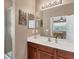 Bathroom with shower, vanity, and mirror at 13542 Abercrombie Dr, Englewood, FL 34223