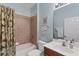 Bathroom with tub, toilet and vanity at 13542 Abercrombie Dr, Englewood, FL 34223
