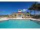 Relaxing community pool with plenty of lounge chairs at 13542 Abercrombie Dr, Englewood, FL 34223