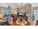 Casual dining area with a round table and chairs near the living room at 13542 Abercrombie Dr, Englewood, FL 34223