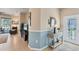 Bright entryway with tile floors, a console table, and access to the living room at 13542 Abercrombie Dr, Englewood, FL 34223