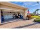 Garage with open door, showing storage items at 13542 Abercrombie Dr, Englewood, FL 34223