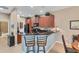 Modern kitchen with dark wood cabinets and granite countertops at 13542 Abercrombie Dr, Englewood, FL 34223