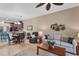 Open concept living and dining room with comfortable furniture at 13542 Abercrombie Dr, Englewood, FL 34223