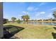 Backyard with pond view and screened patio at 13678 Yelma St, Venice, FL 34293